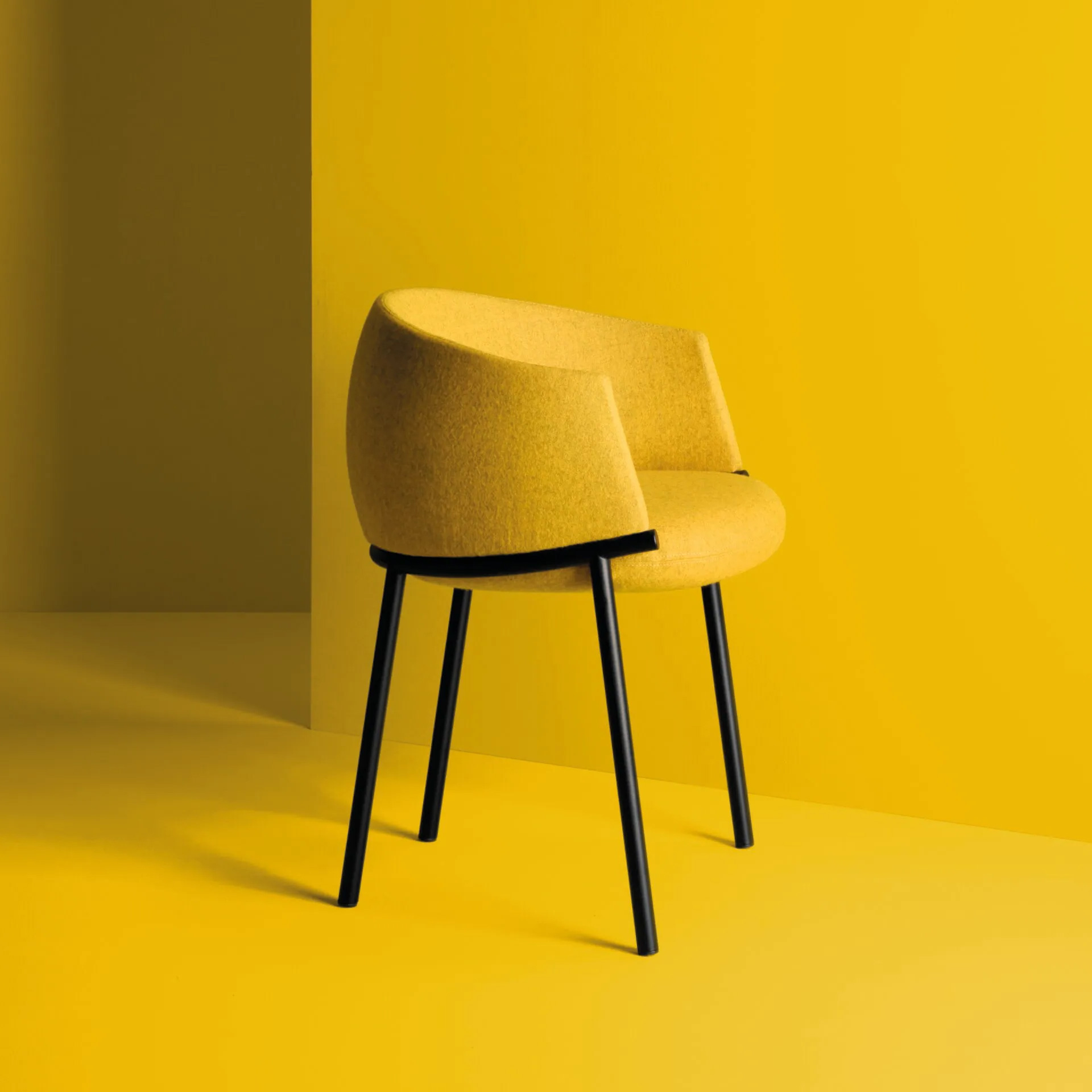 Upholstered metal armchair Koala